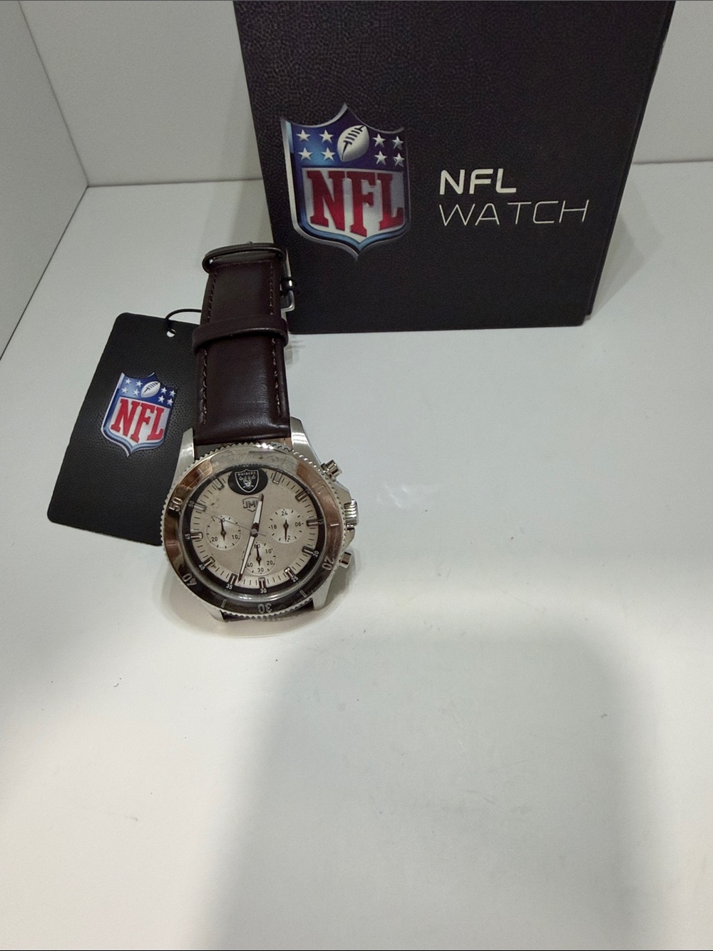 NFL Raiders Silver-Tone Chronograph Watch with brown leather watchband.
